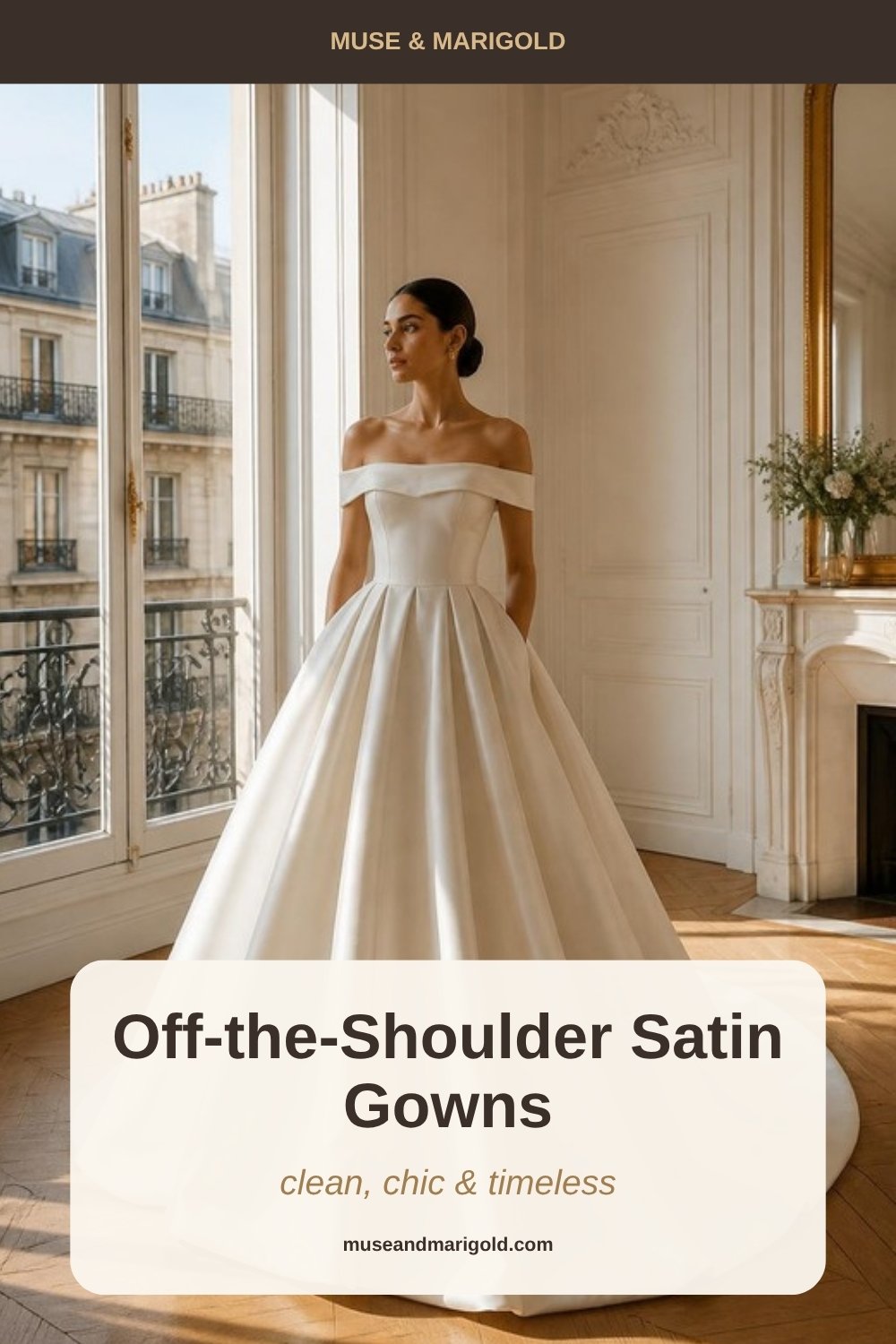 Bride in an off-the-shoulder ivory satin ball gown by a tall window in a Parisian apartment with herringbone wood floors